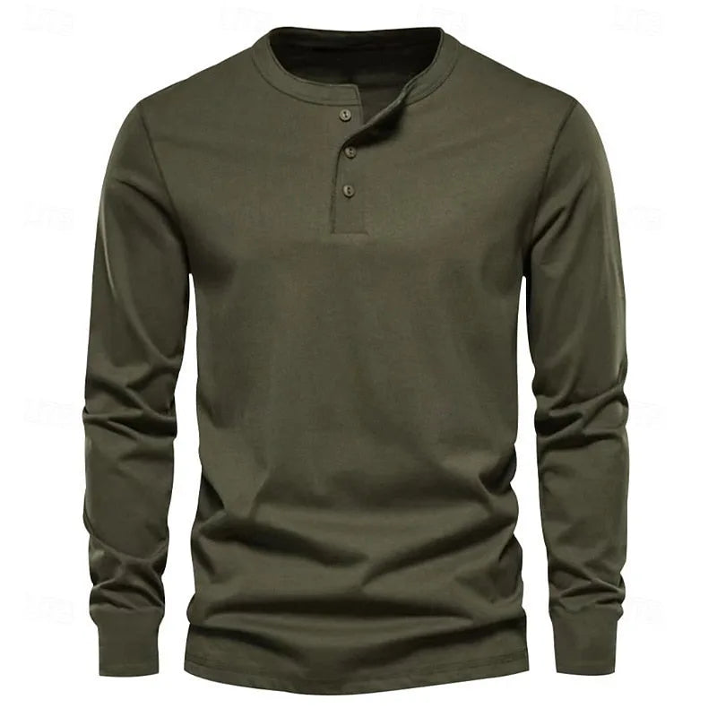 Close-up of the blue henley worn by a model, showing the soft jersey fabric texture