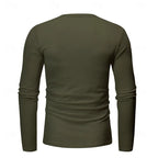 Close-up of the black henley worn by a model, showing the fitted long sleeve and cuff