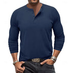 Close-up of the ribbed cuff detail on the sleeve of the light grey henley shirt
