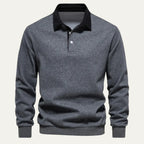 Front view of a dark grey marl long sleeve polo jumper with black contrast collar on a plain background