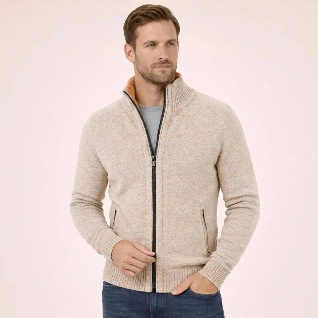 Side angle of the cream marl zip cardigan with hands tucked into jean pockets