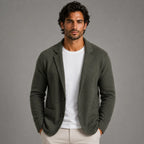 Side angle of a beige knit blazer cardigan on a hanger, showing the drape and notch lapel shape