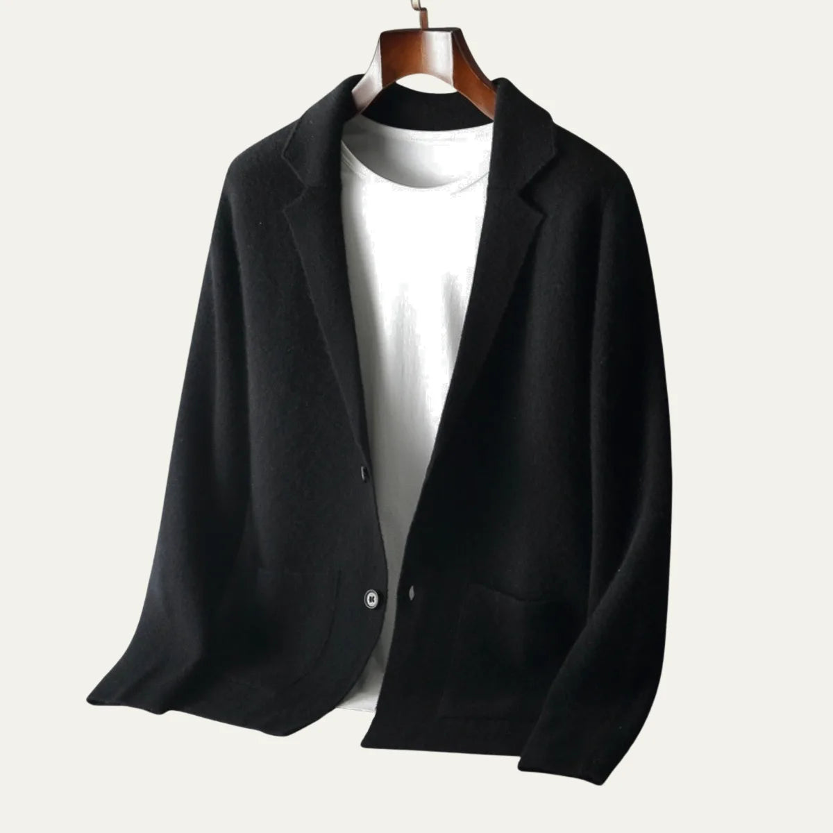 Brown knitted blazer cardigan laid flat, showing the two-button front closure and patch pocket placement