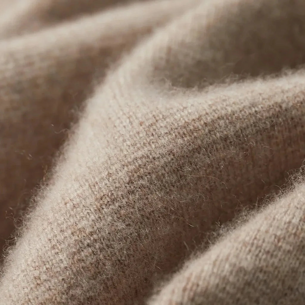 Brown knitted blazer cardigan on a hanger, full front view with buttons open and pockets visible