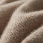 Brown knitted blazer cardigan on a hanger, full front view with buttons open and pockets visible