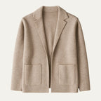 Flat-lay front view of a beige knit blazer cardigan showing the notch lapel, patch pockets and clean hem