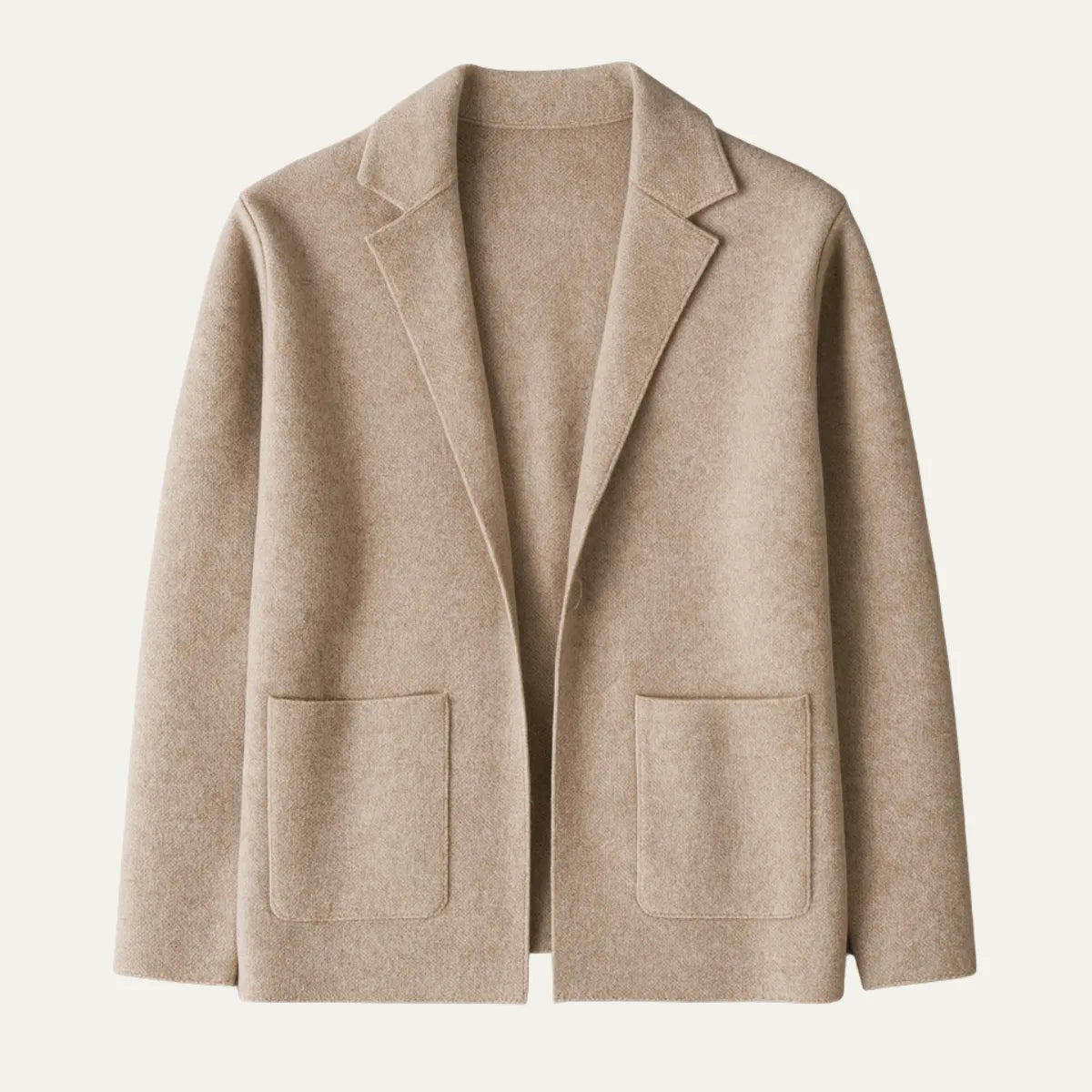 Flat-lay front view of a beige knit blazer cardigan showing the notch lapel, patch pockets and clean hem