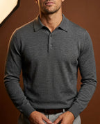 Charcoal grey knitted polo jumper in fine merino wool, shown with ribbed cuffs and classic collar