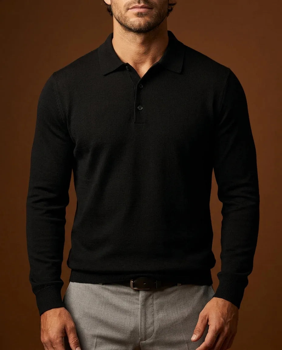 Black merino wool long-sleeve polo jumper with a smooth knit finish, styled with grey trousers