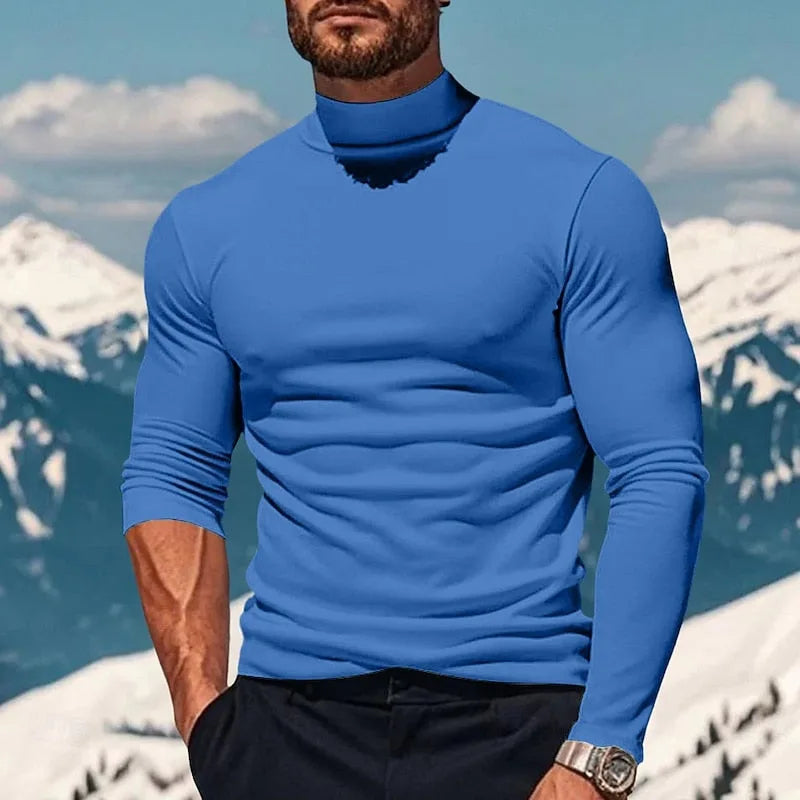 Front view of a royal blue mock neck long sleeve top with a slim, tailored fit on a male model