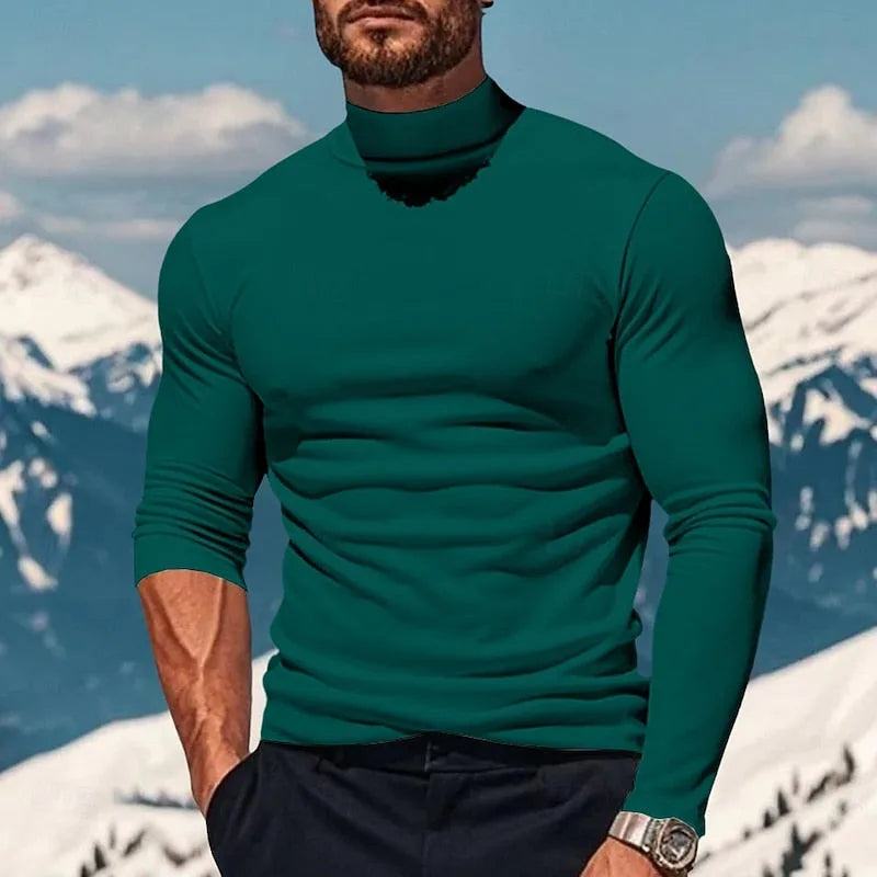 Man wearing a teal green mock neck top, close-up showing the ribbed neckline and smooth fabric texture