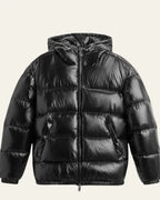 Close-up of the ribbed cuff and sleeve finish on the black puffer jacket