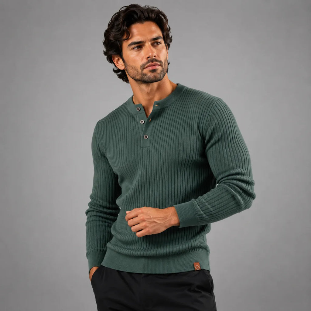 Flat lay of a dark brown ribbed henley jumper showing the ribbed sleeve and cuff finish