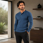 Side view of a black ribbed henley jumper flat lay, showing the dropped hem with leather tab