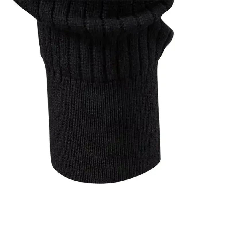 Overhead flat lay of a black ribbed knit henley jumper showing full sleeve length and body shape