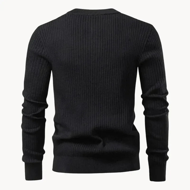 Back view of a black ribbed knit henley jumper, showing the plain ribbed back panel