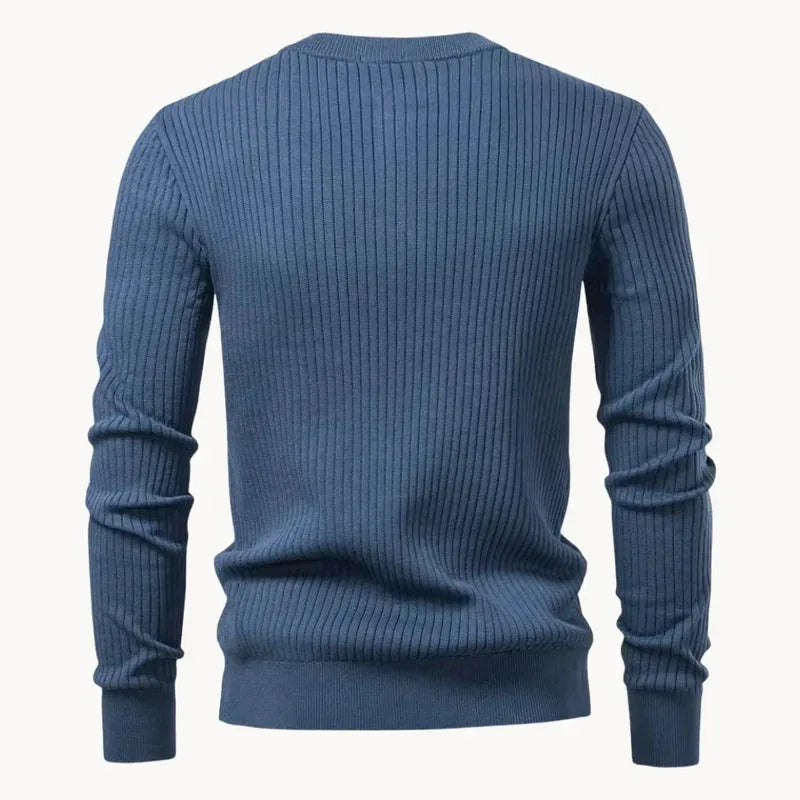Back view of a slate blue ribbed knit henley jumper laid flat, showing continuous vertical ribbing