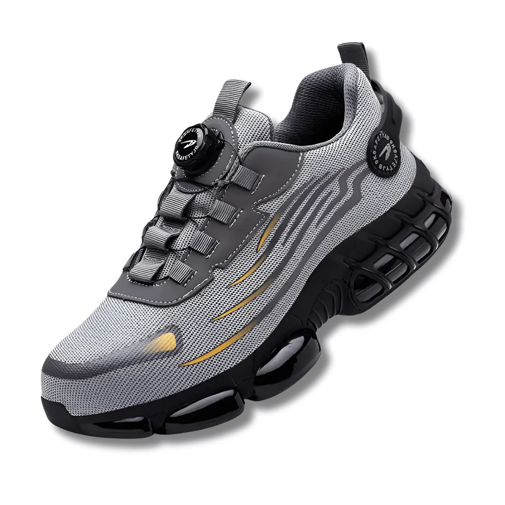 Side angle of a grey and black mesh trainer with dial closure, gold accent lines and layered outsole