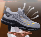 Grey trainer shown mid-air with arrows illustrating the breathable mesh upper and airflow design
