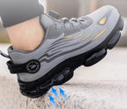 Close-up of a grey trainer's heel and ridged sole against a stone ledge with upward motion arrows