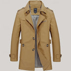 Navy blue trench coat close-up of collar, epaulette strap and buckled neck tab