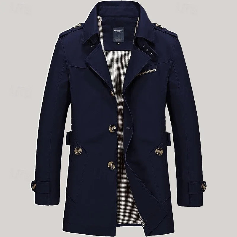 Navy blue trench coat, front view with epaulettes and checked interior lining