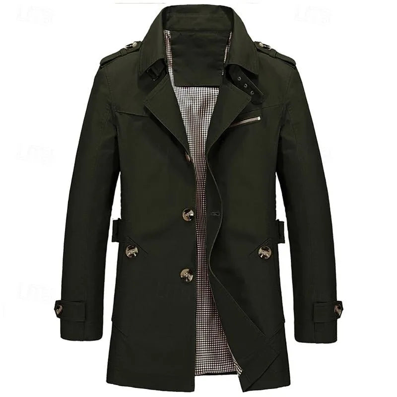 Beige trench coat close-up showing metal button detail and welt pocket with tab closure