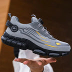 Lifestyle shot of a single trainer held above an open palm, showcasing the full silhouette