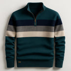 Dark green quarter-zip jumper with navy and cream chest stripes, branded hem tab, front flat lay