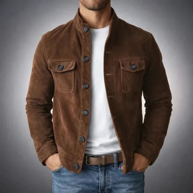 Close front view of a brown suede jacket showing the stand collar, flap pockets and leather belt underneath