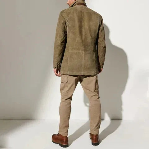 Rear view of khaki jacket worn with beige cargo trousers and brown leather boots, showing fitted back seam