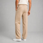 Rear view of beige tailored trousers showing back welt pockets and straight leg cut