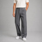 Front view of grey flannel-look tailored trousers with front pleat and straight leg