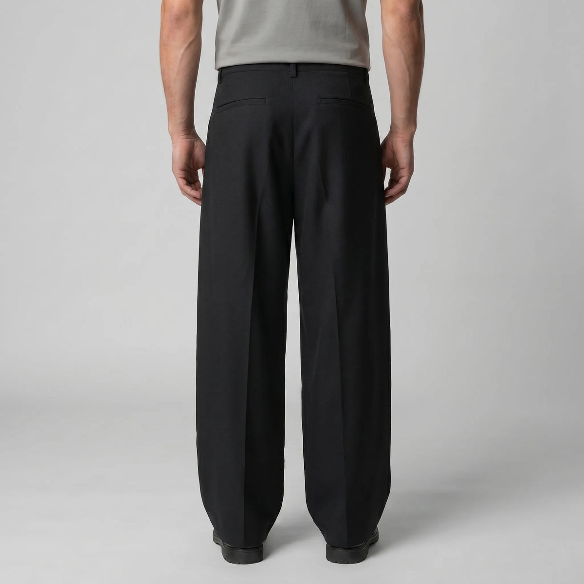 Detail shot of the belt loops and button fastening at the waistband