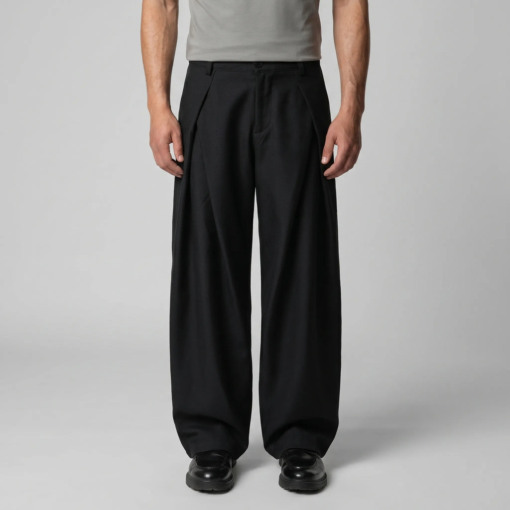 Full front view of the grey trousers paired with dark brown lace-up shoes against a plain backdrop