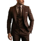 Close-up of a dark brown three-piece suit with satin peak lapels, waistcoat and brown patterned tie
