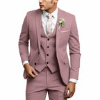 Dusty pink three-piece suit with notch lapel blazer, black buttons and floral tie