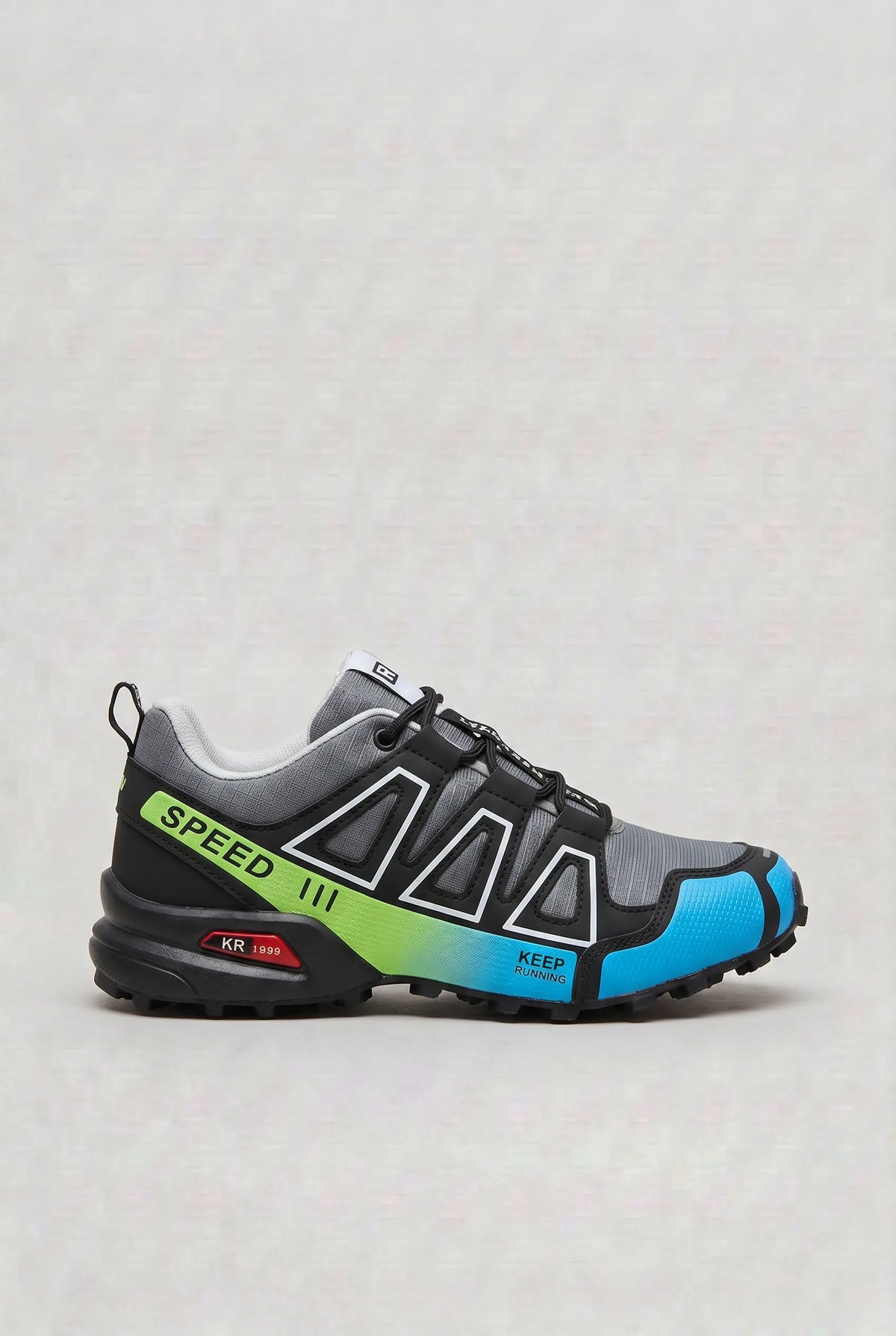 Side view of grey trainer with black overlays, neon green gradient panel and blue heel detail reading Speed and Keep Running