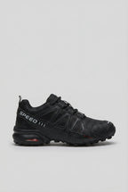 Side profile of an all-black trainer with tonal ripstop texture and subtle grey Speed branding