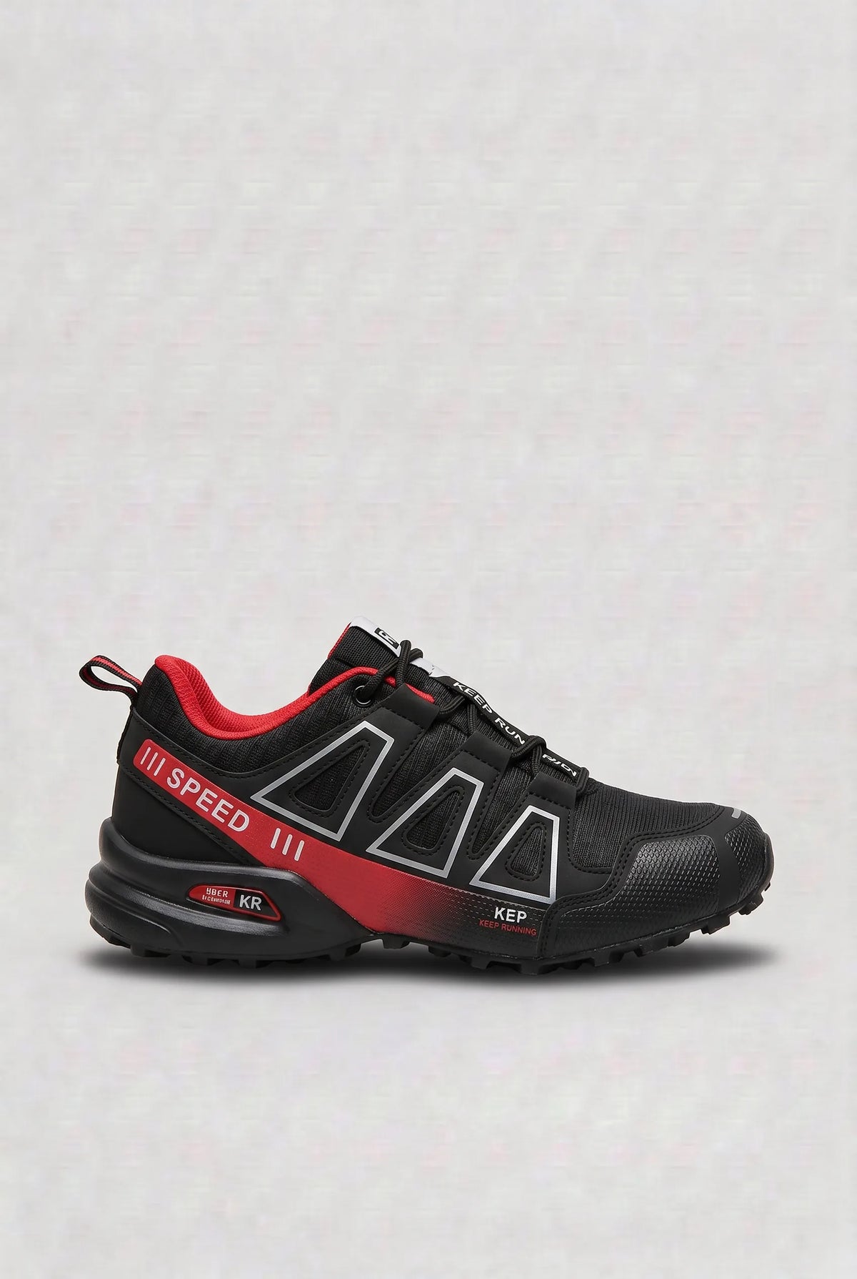 Side view of black trainer with red gradient side panel and red accented heel and laces