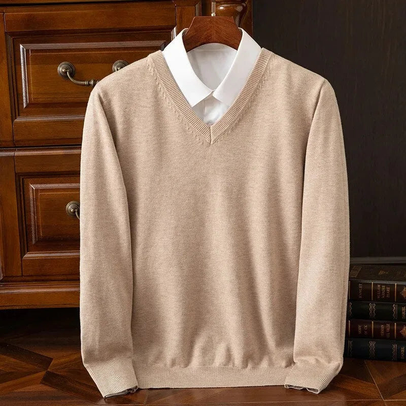 Beige V-neck jumper with white shirt underneath, front view highlighting the knit texture
