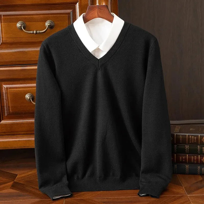 Black V-neck jumper with crisp white shirt collar, front view showing ribbed trims and relaxed fit