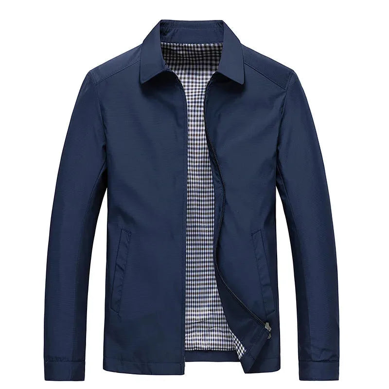 Navy blue jacket with classic point collar, front zip and welt pockets, shown open against a plain background