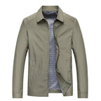 Beige jacket in khaki tone with point collar and zip front, styled open to show clean tailored lines
