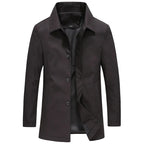 Black longline windproof jacket shown open, buttoned front, pointed collar and dark lining visible