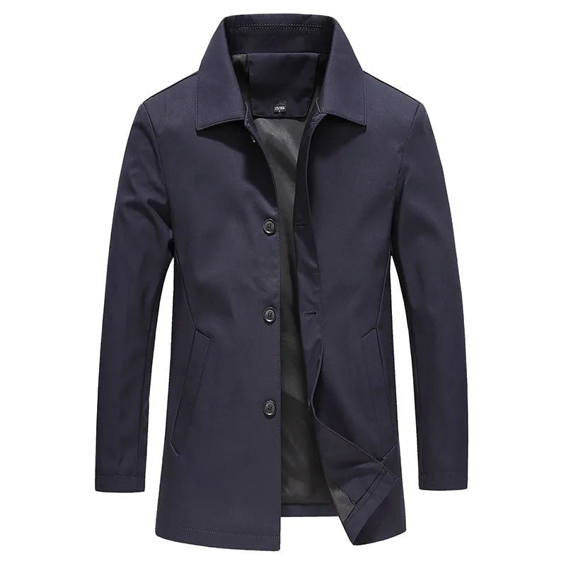 Navy longline windproof jacket, fully buttoned, worn straight on against a plain background