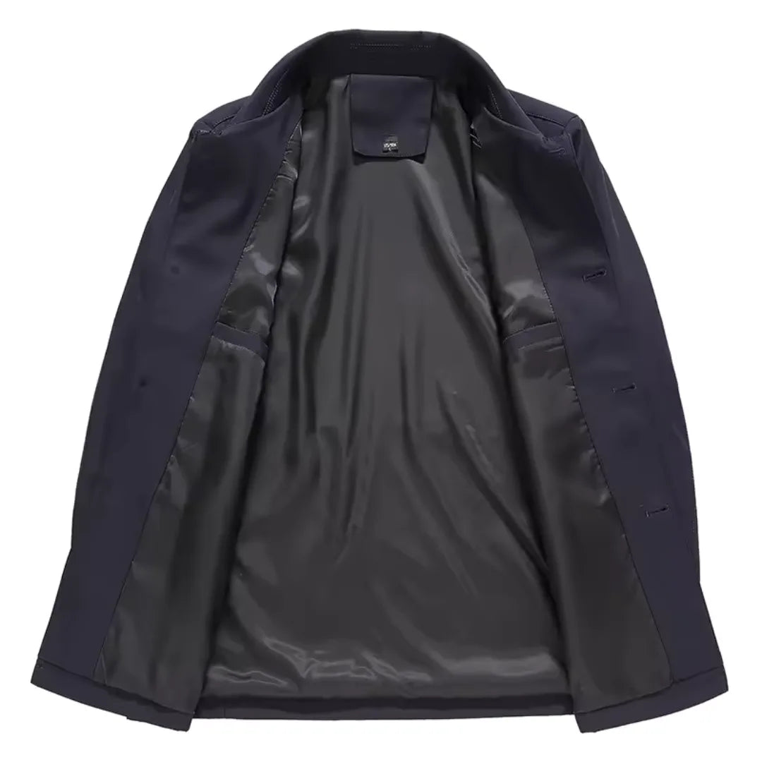 Navy jacket laid open flat, revealing the smooth dark interior lining and inner pocket stitching