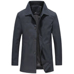 Charcoal grey longline windproof jacket, unbuttoned at the collar, front view on a plain background