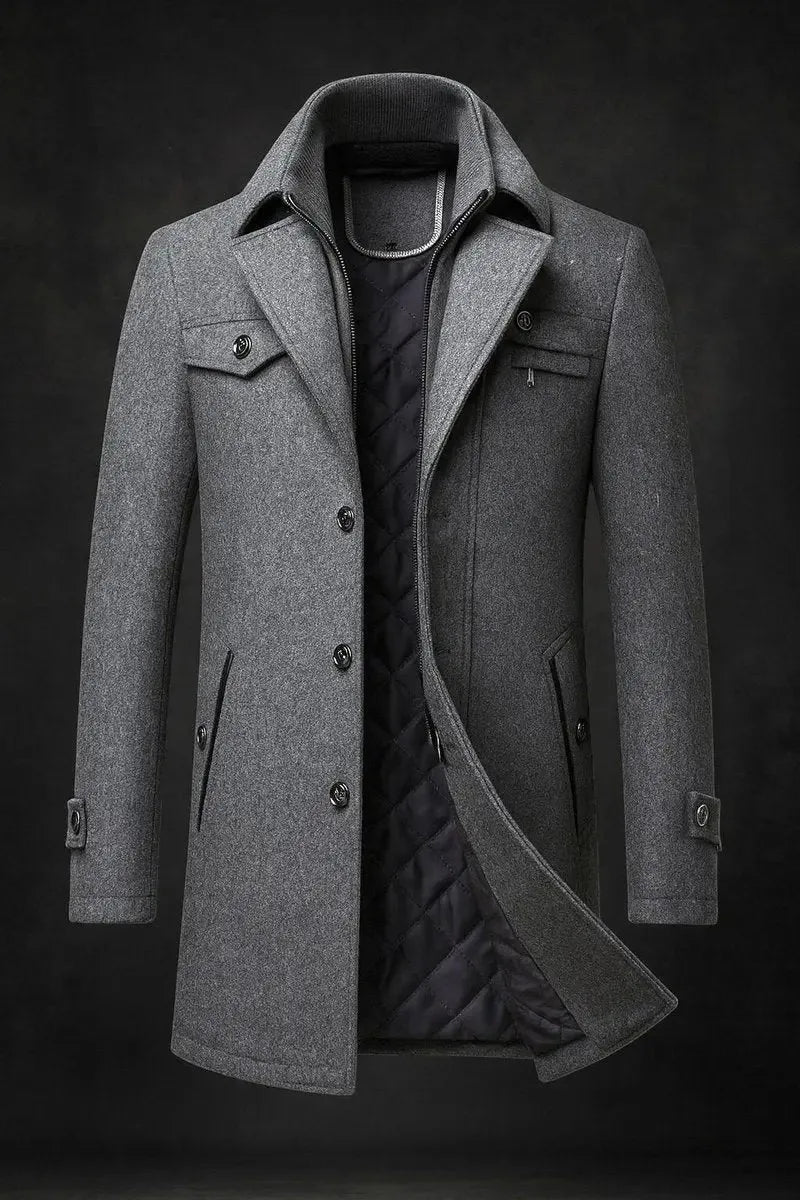 Grey wool overcoat with stand collar, zip-lined neckline and welt pockets, shown fully buttoned and unzipped