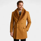 Man in camel double-breasted wool coat with brown fur collar, black tie, hand in pocket